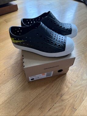 Native Black Slip-On Sneakers with Neon Lightning Bolt Accent
